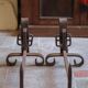 Brutalist cast iron fireplace grates in the shape of a belt, decor.