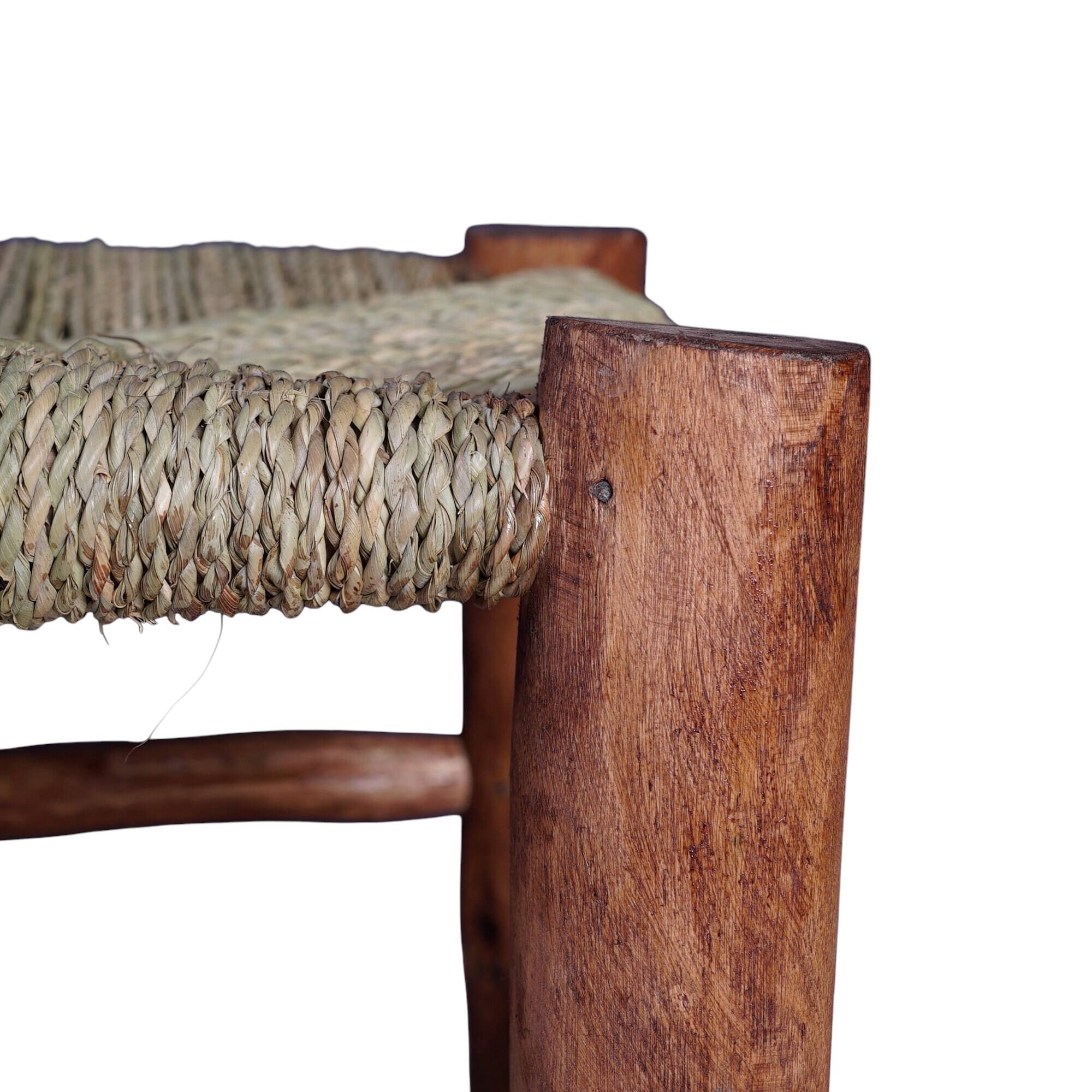 Wooden bench and woven rope