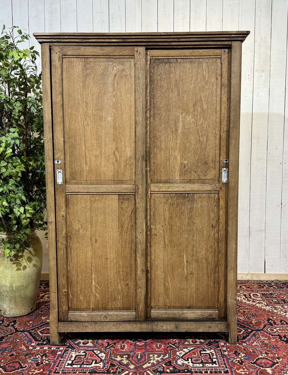 Oak wardrobe with sliding doors from the 1930s.