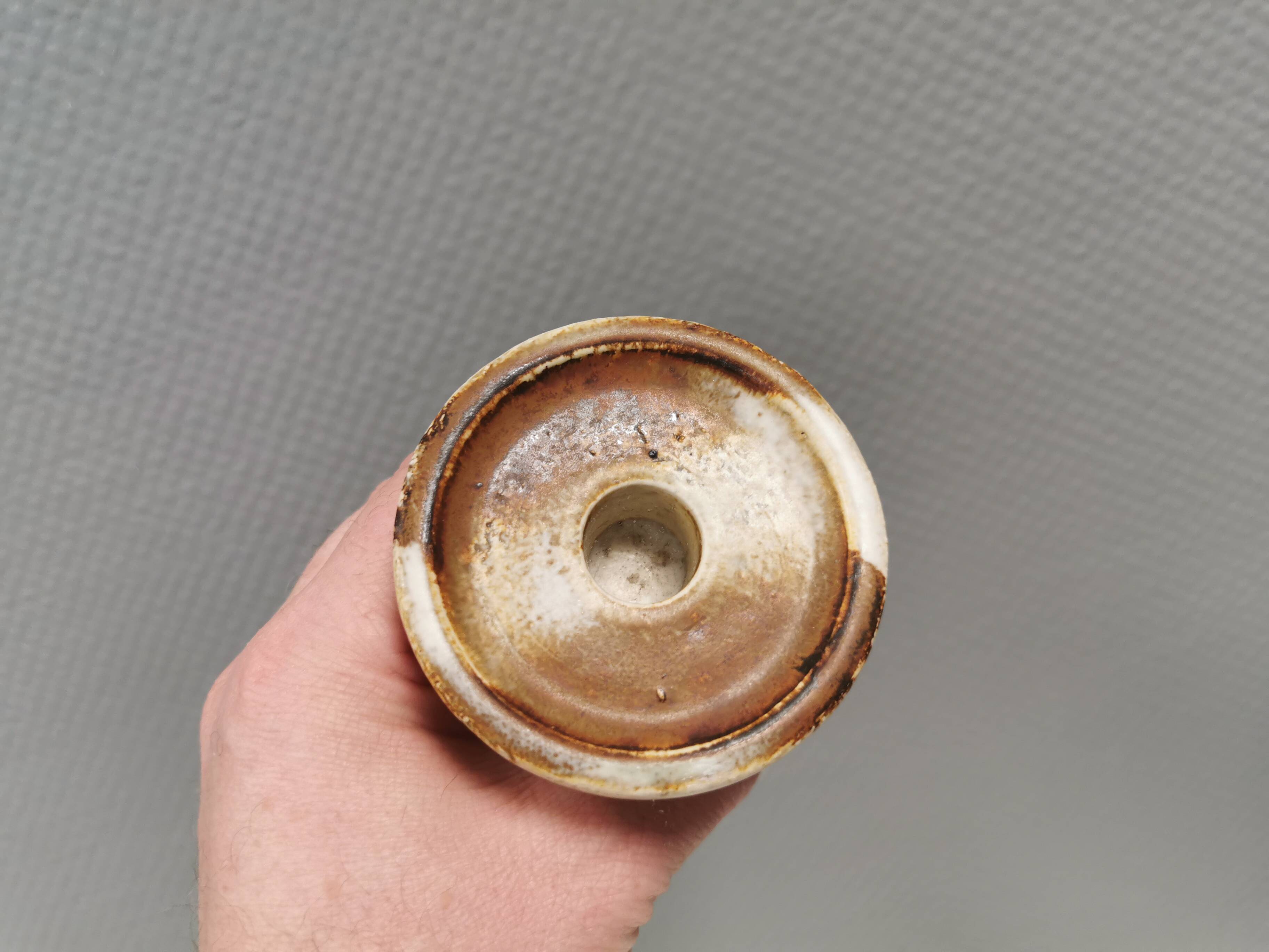 A set of ceramic candleholders by Axel Larsen for his own company, Axella