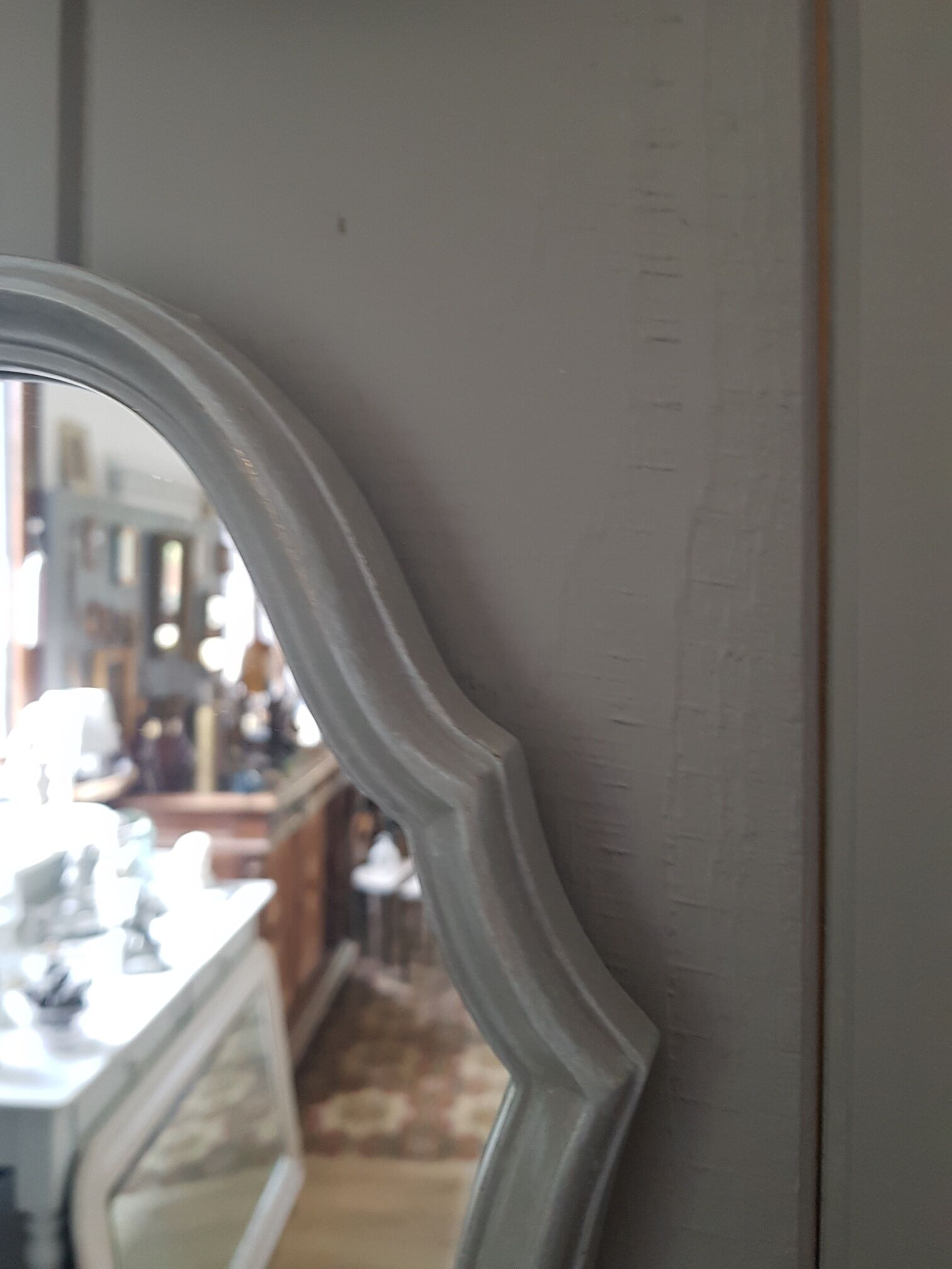 Grey patinated baroque mirror