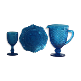 Old table set in blue pressed moulded glass