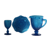 Old table set in blue pressed moulded glass