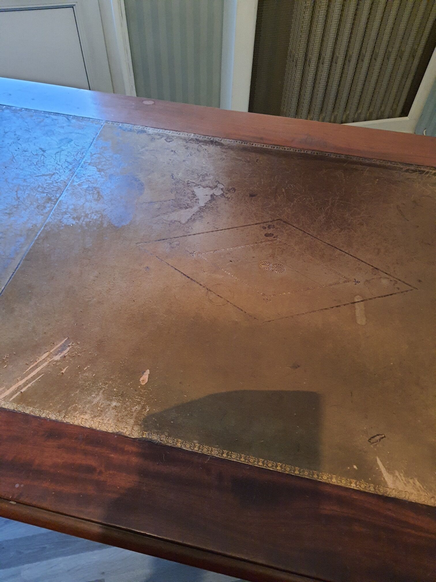 Mahogany desk on leather