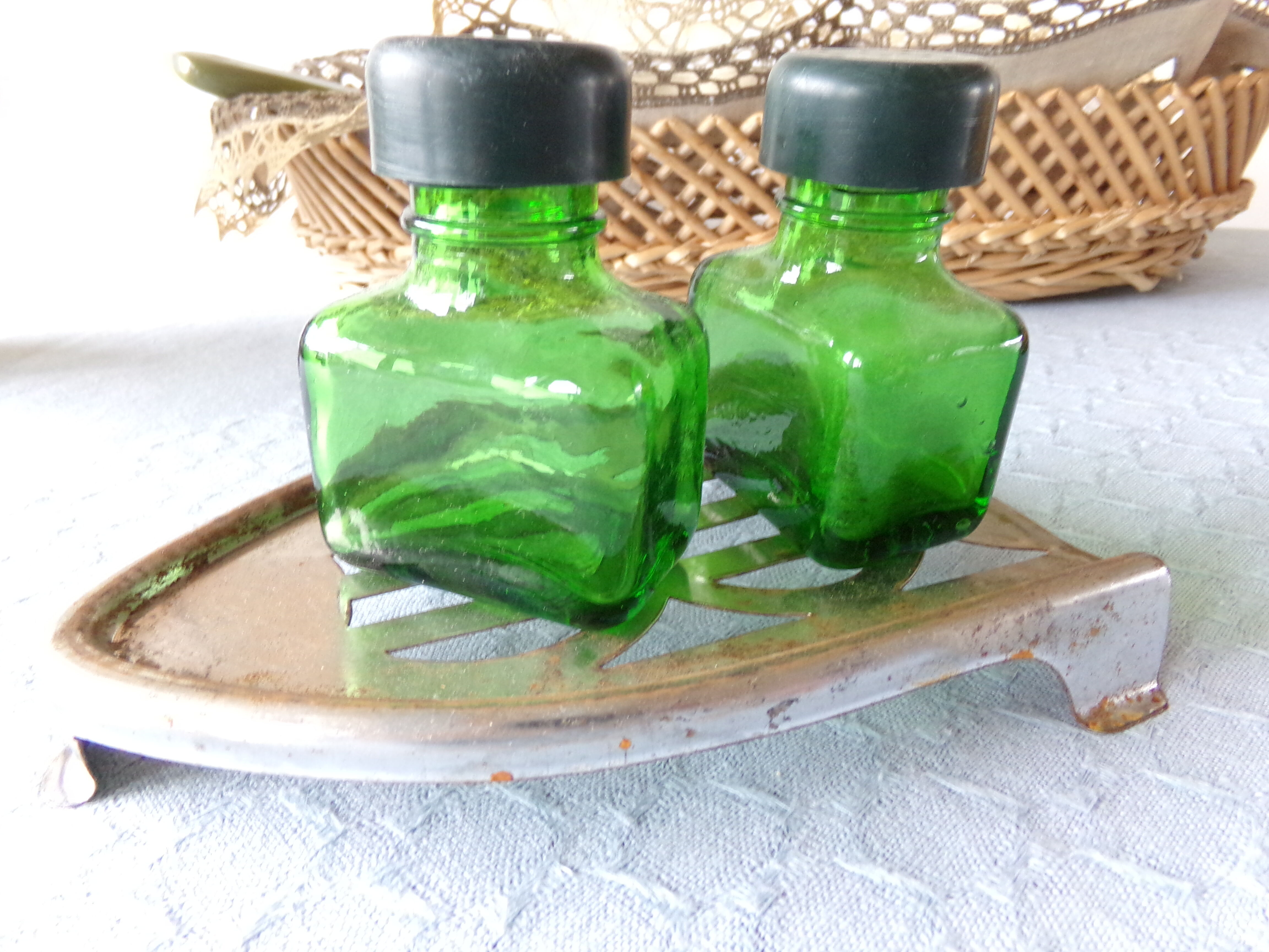 Salt/pepper green glass jars on metal base