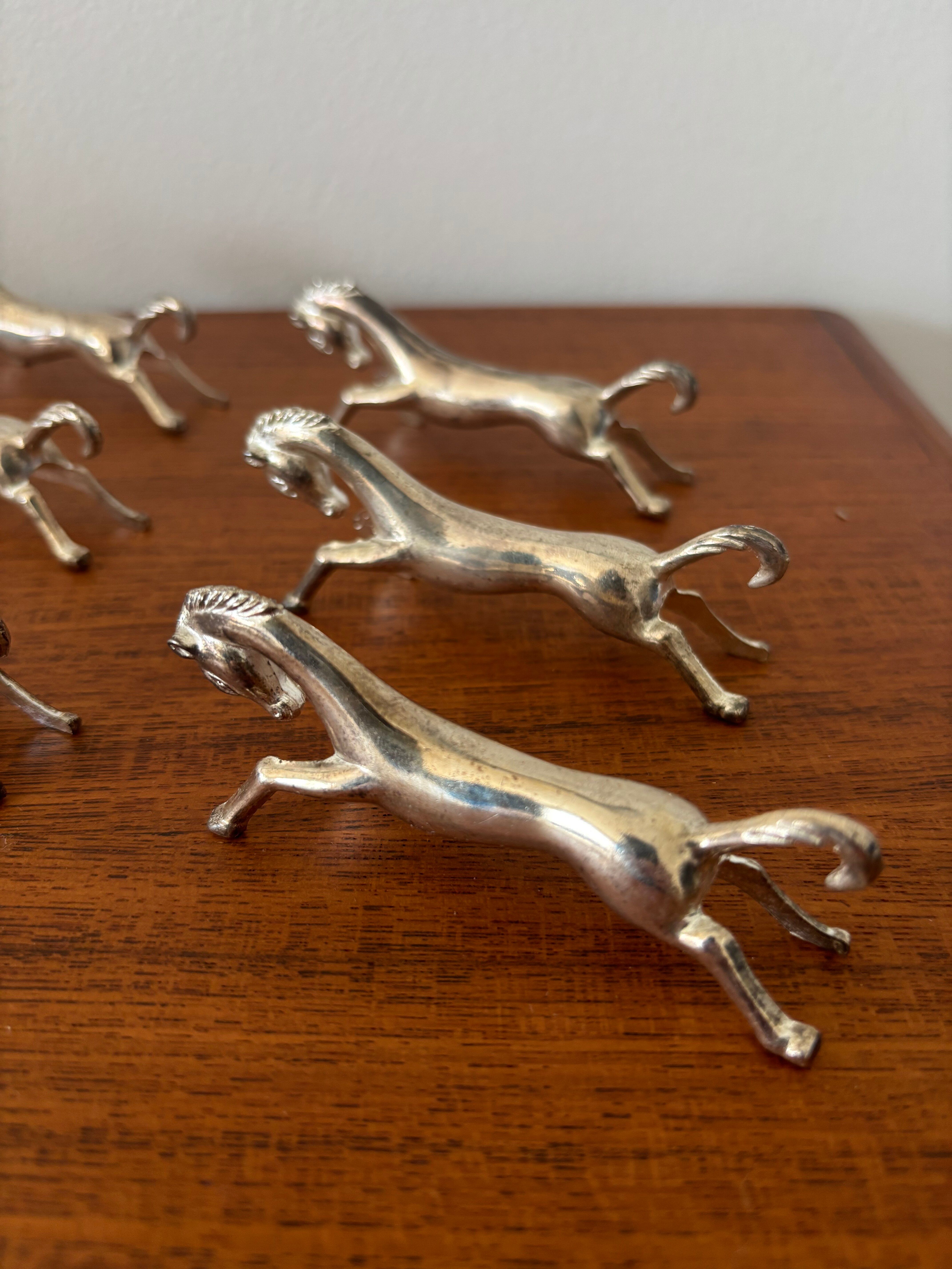 Set of 6 vintage galloping horse knife rests in silver-plated metal.