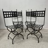 Set of four wrought iron chairs, with a reclining X-shaped base, seat and backrest.