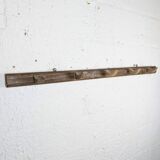 Handcrafted wall coat rack in raw wood