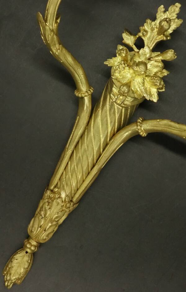 Pair of large wall sconces with flowers in the Louis XVI style from the 19th century - gilded bronze.