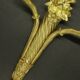 Pair of large wall sconces with flowers in the Louis XVI style from the 19th century - gilded bronze.