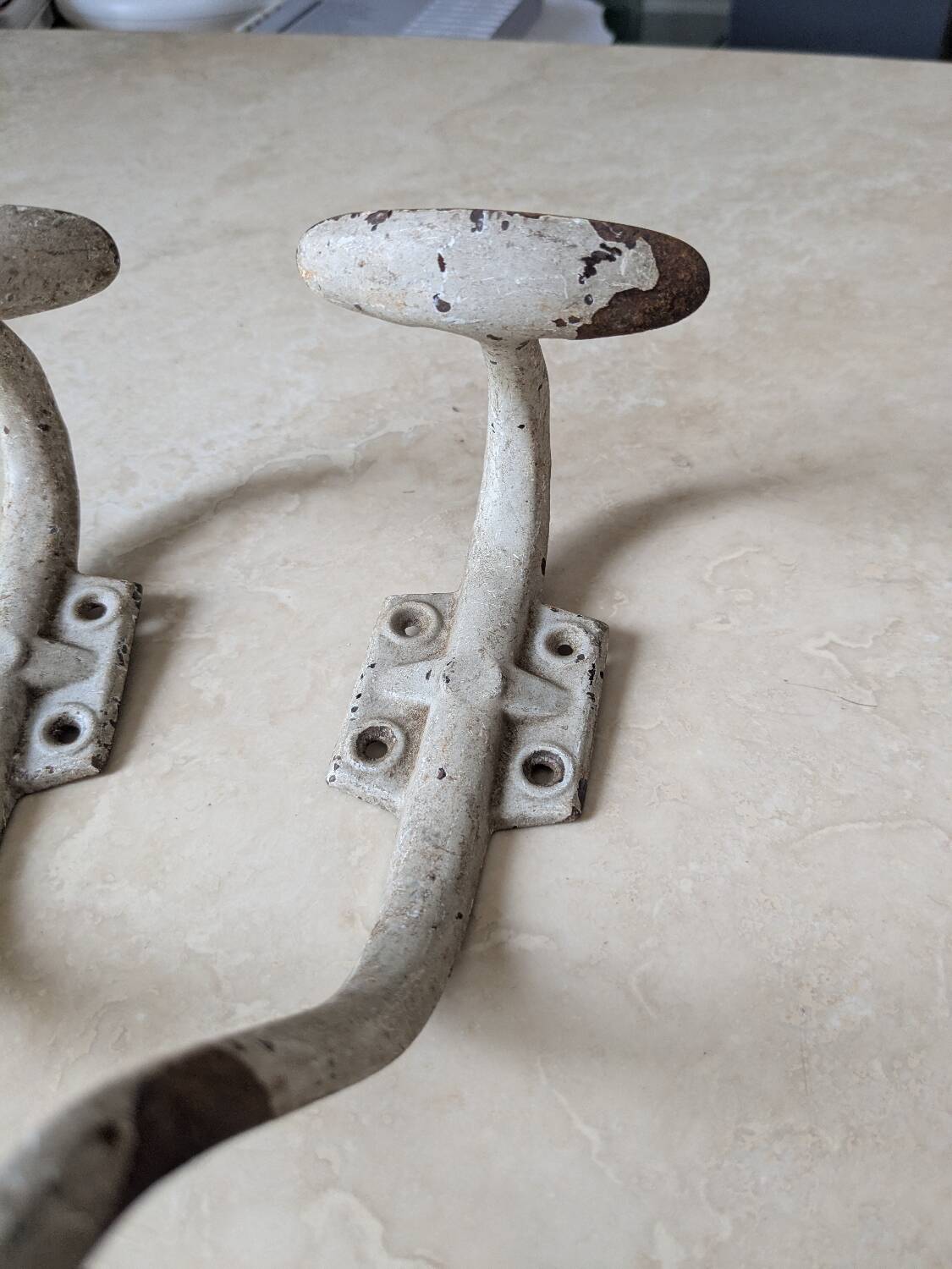 Two vintage coat hooks
