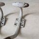 Two vintage coat hooks