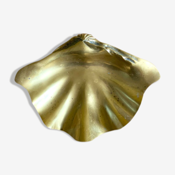 Large empty pocket in the shape of a golden brass shell