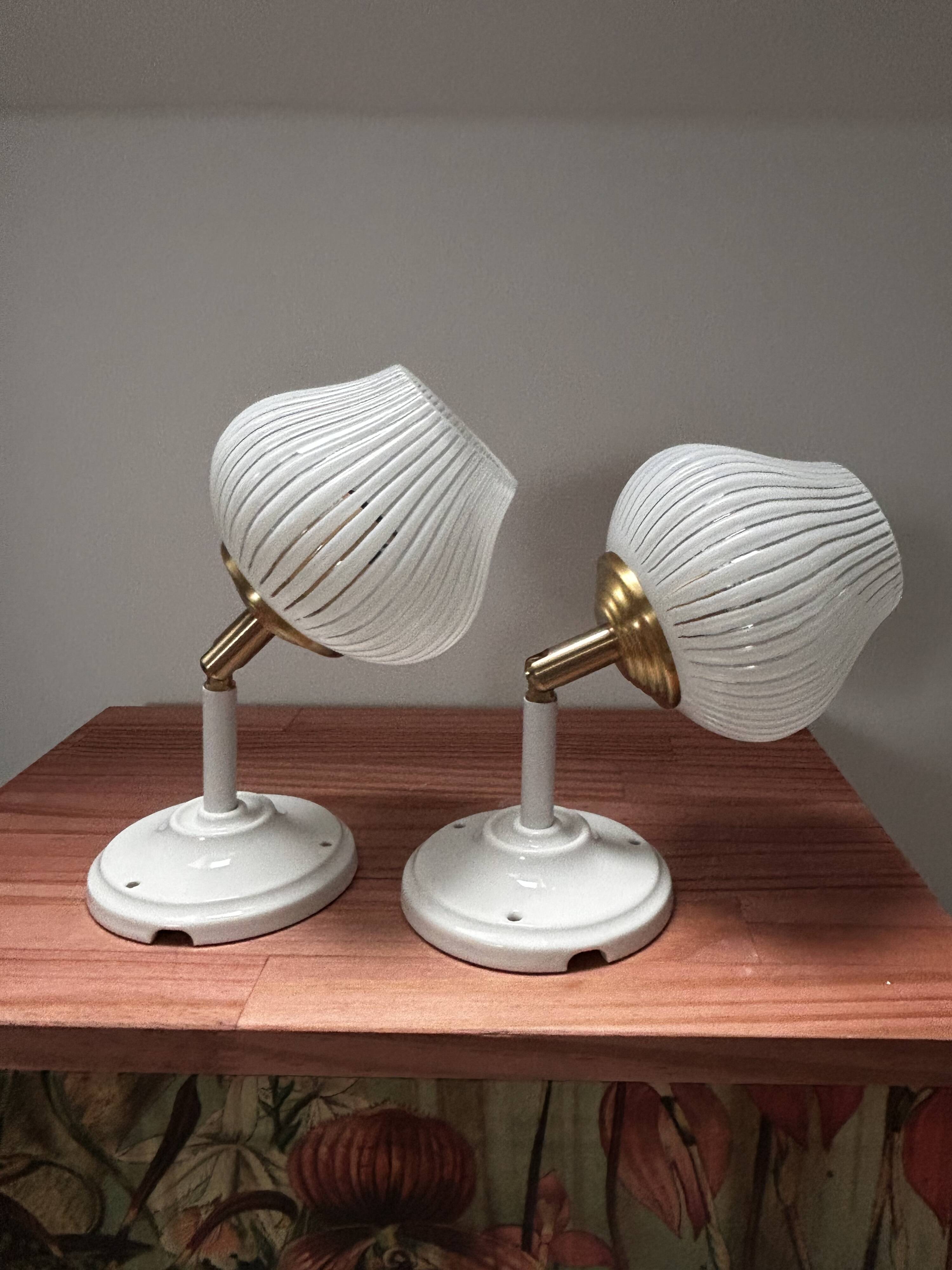 Pair of vintage white globe tilting wall sconces