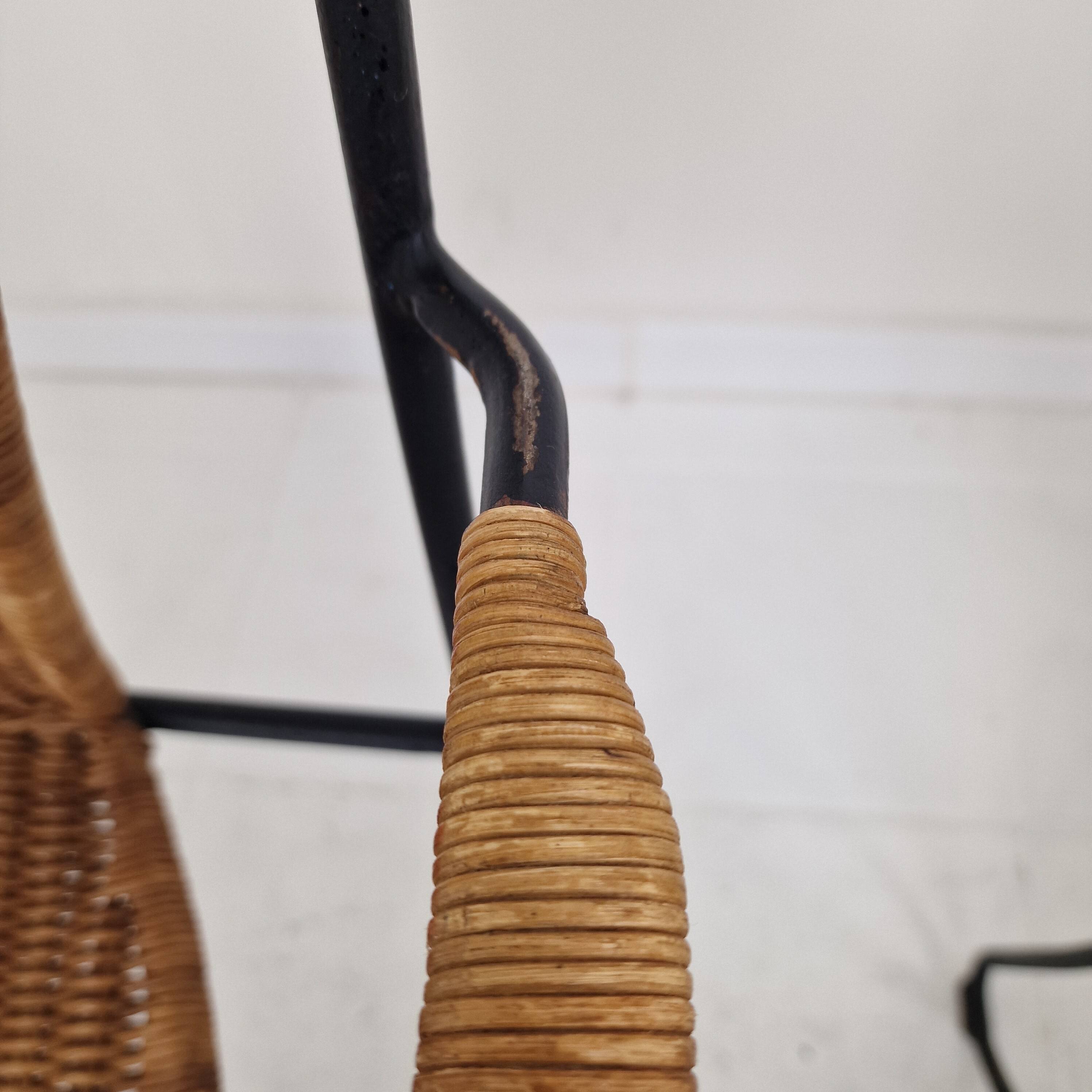 Pair of wicker and iron armchairs by Frederic Weinberg, United States, 1950s.