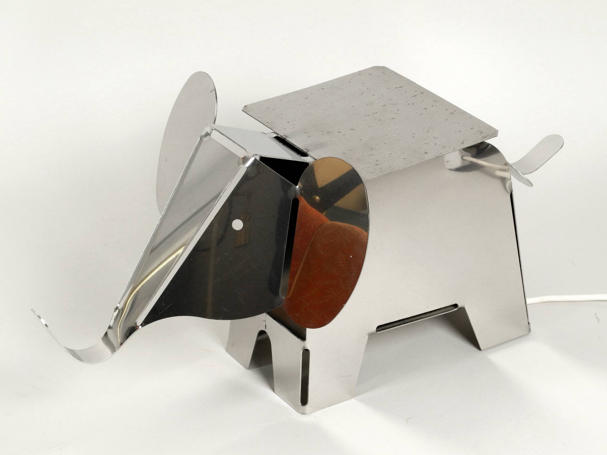 80s heavy metal chrome elephant floor lamp as side table Postmodern design