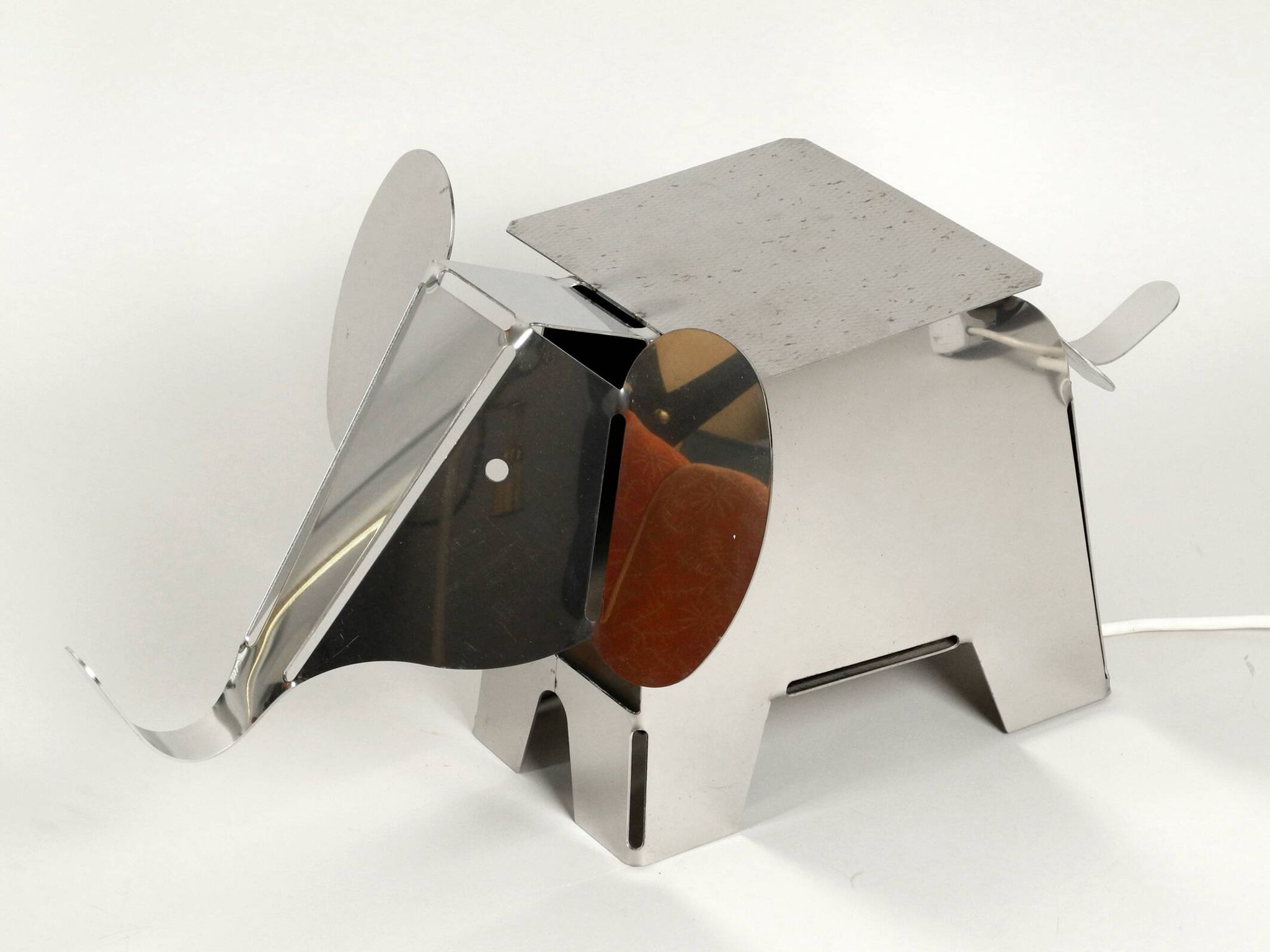 80s heavy metal chrome elephant floor lamp as side table Postmodern design