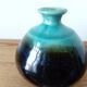 Small brown and turquoise ceramic vase
