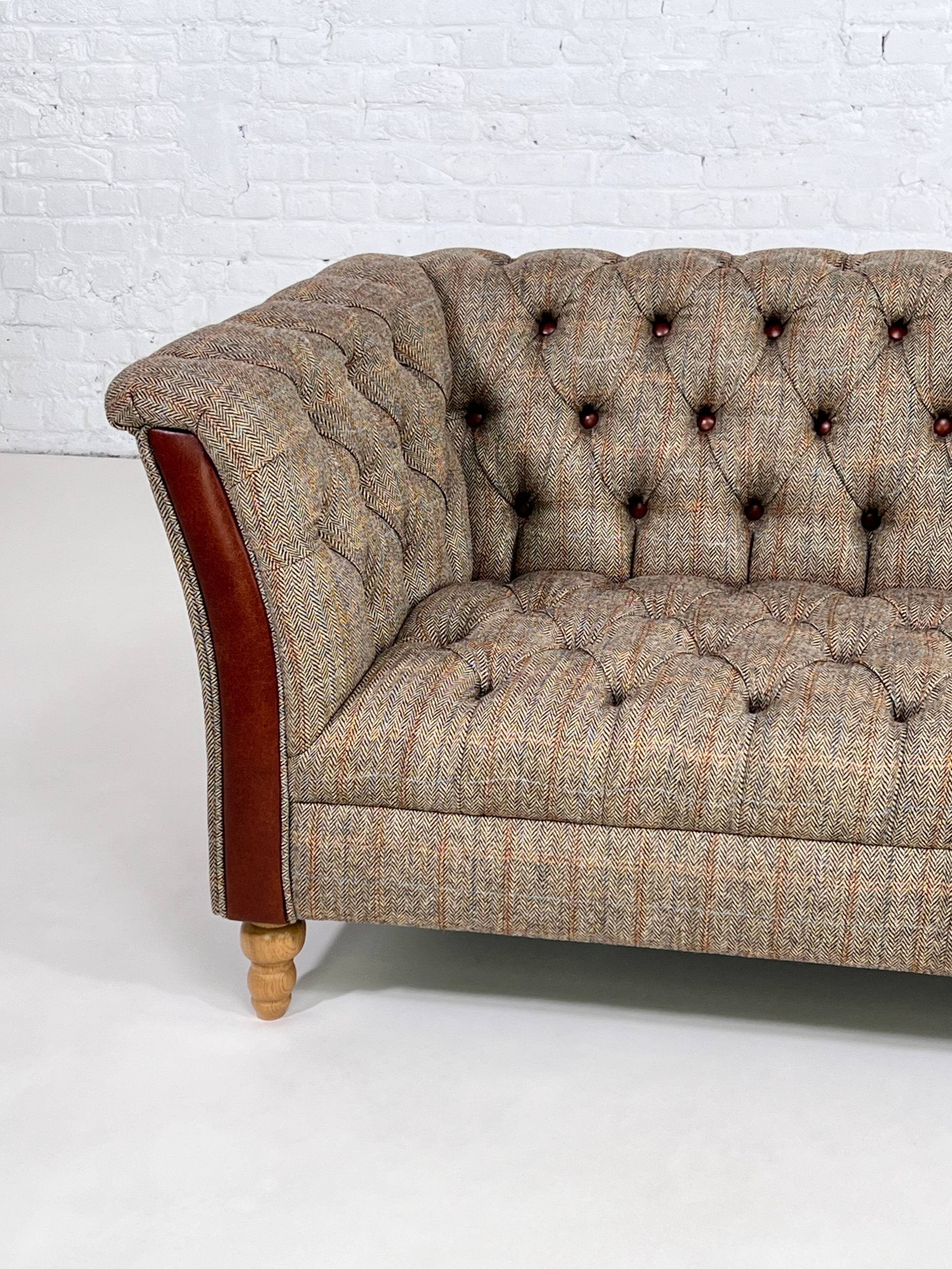 Chesterfield sofa in leather, fabric and wood