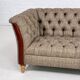 Chesterfield sofa in leather, fabric and wood