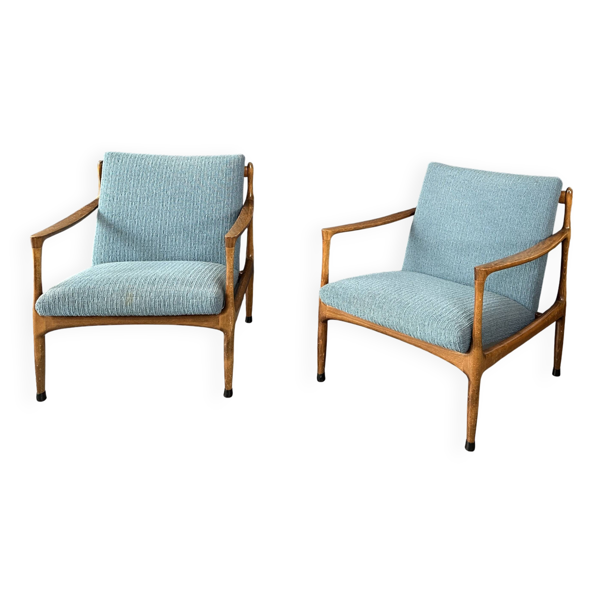 A pair of turquoise armchairs