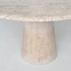 Large sculptural round dining table in cream white travertine, Italy, 1970.