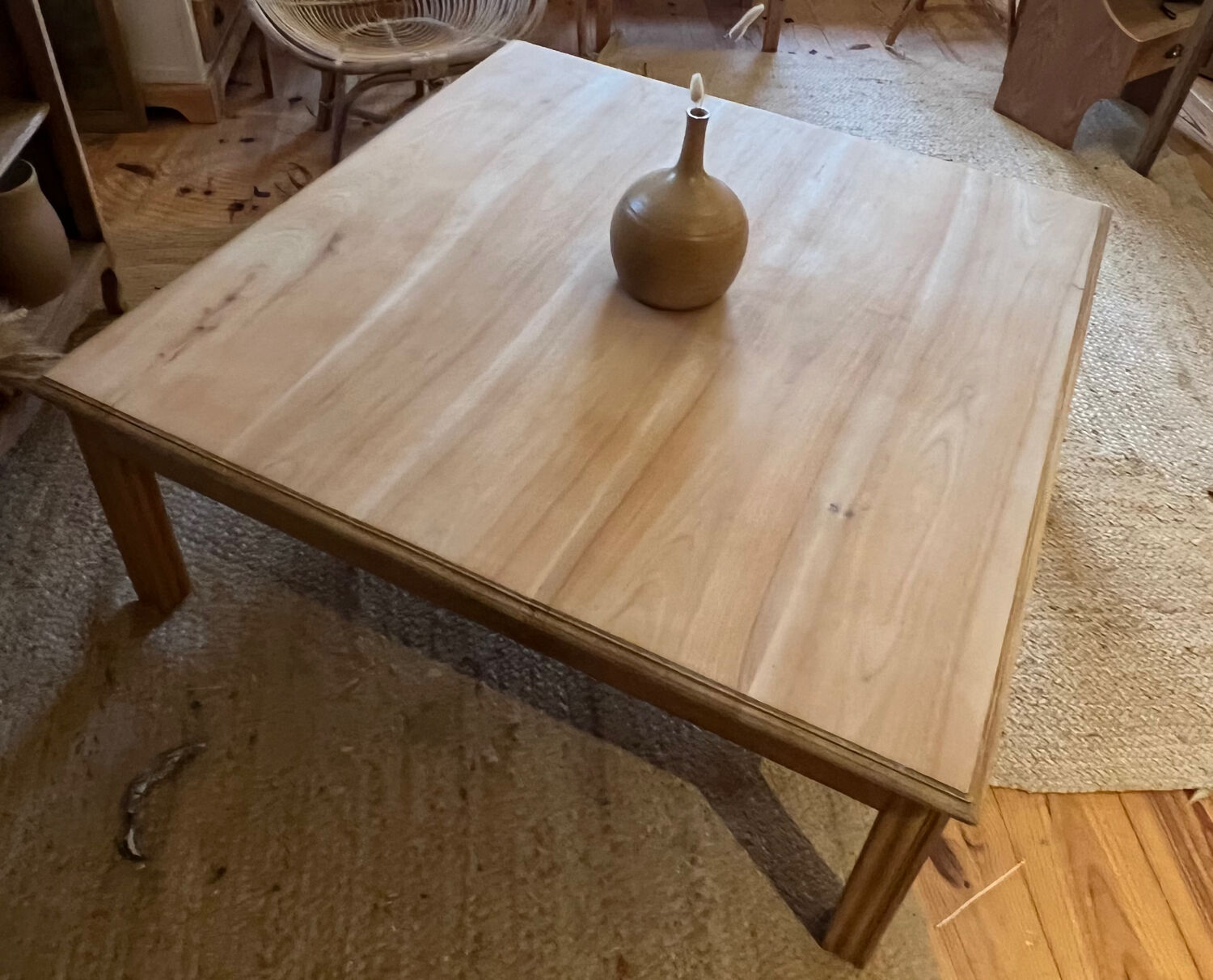 Large square antique coffee table made of raw solid wood.
