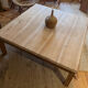 Large square antique coffee table made of raw solid wood.
