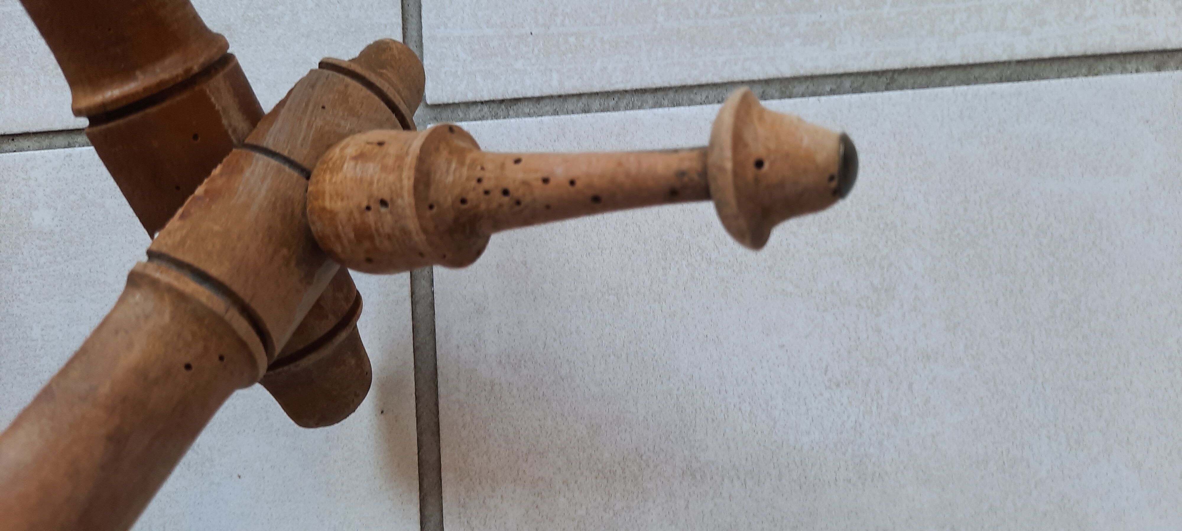 Old accordion wall coat rack