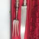 Antique silver-plated metal serving cutlery.