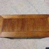 Chest of drawers with decorated handles in the Louis XVI style.