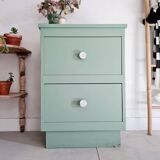 Old chest of drawers with two green drawers