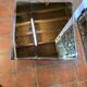 Chrome coffee table with smoked mirror top