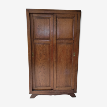 Armoire vintage pieds compas portes coulissantes en chêne