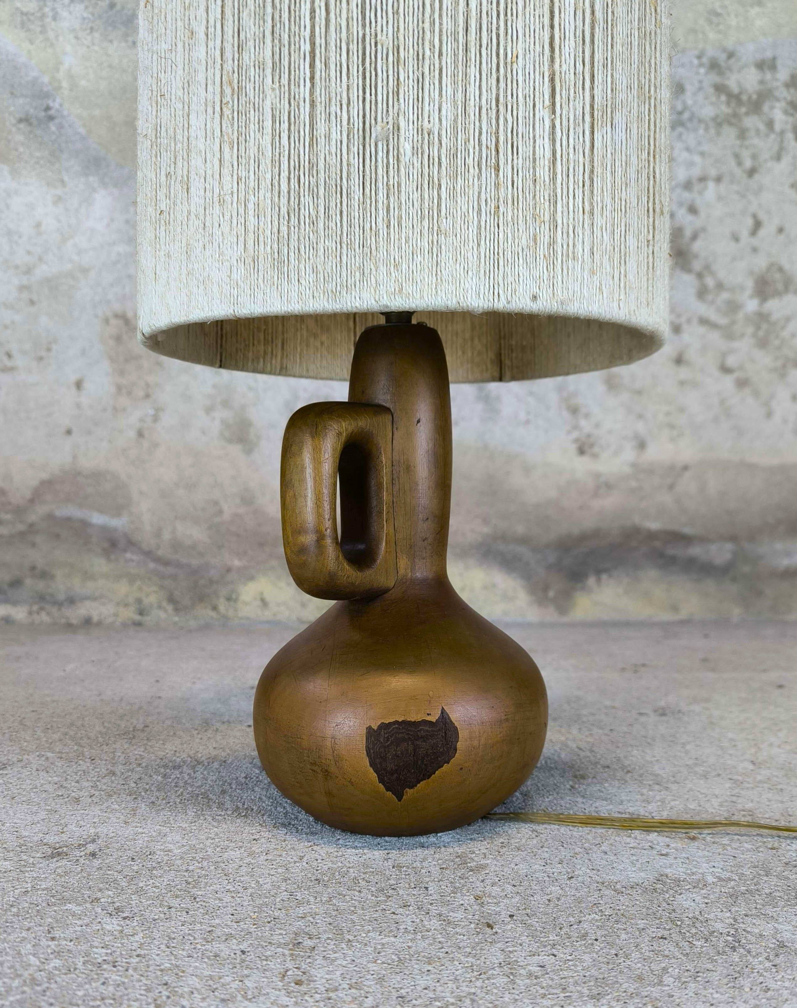 Vintage wooden table lamp with a wool shade.