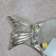 Glass and silver-plated fish trivet