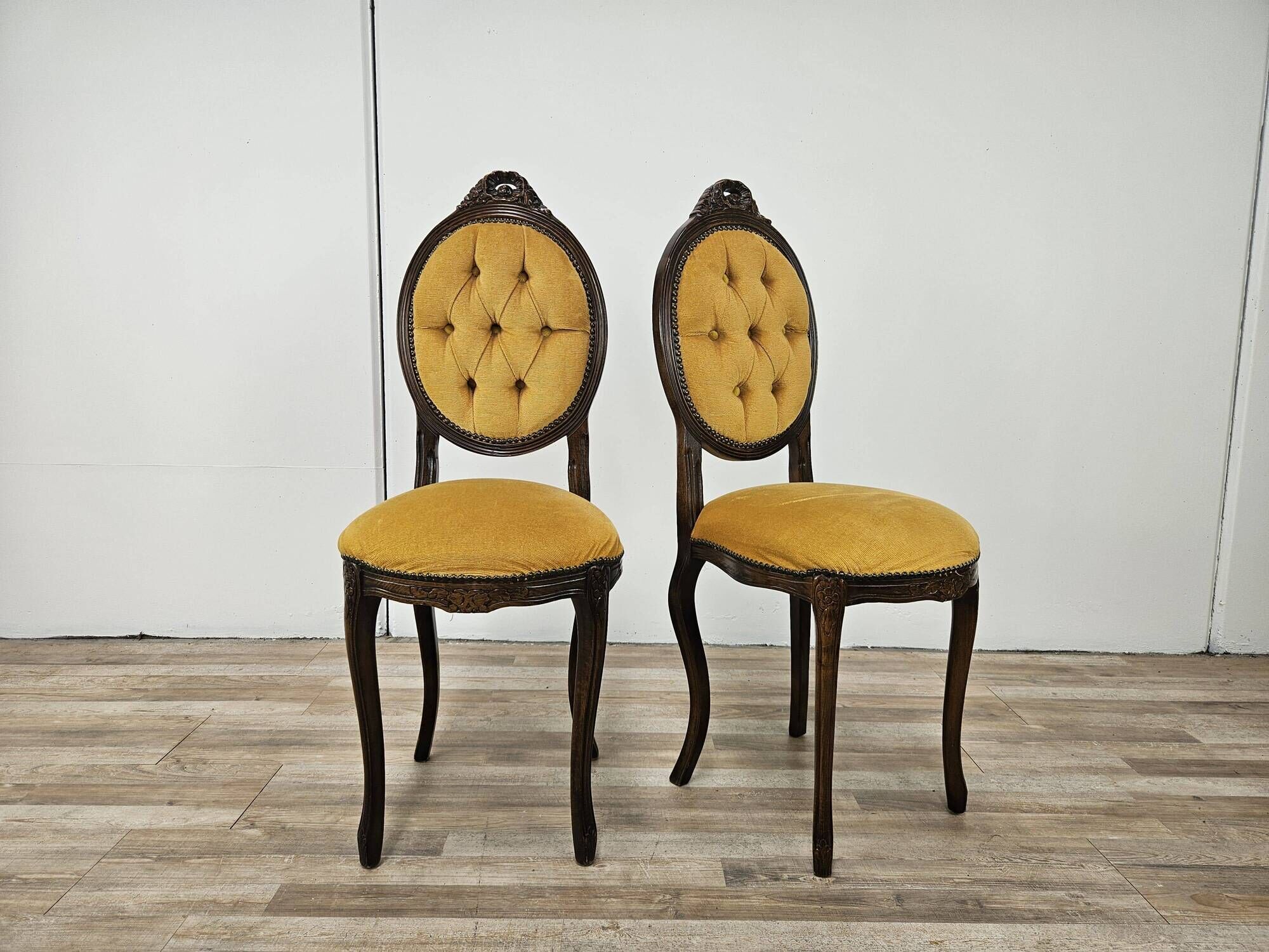 Pair of early 1900s wooden chairs with padded seat and backrests