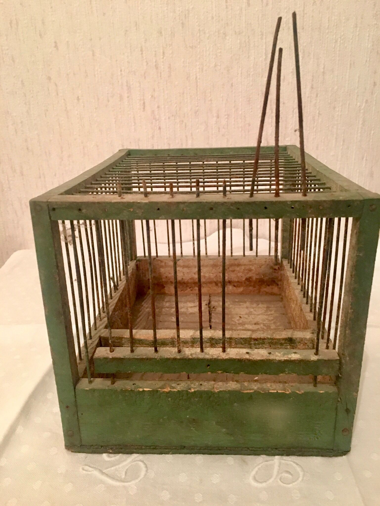 Green wooden bird cage