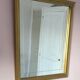 Miroir en bois doré, de forme organique avec une glace biseauté