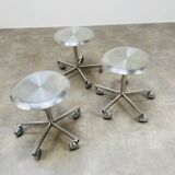 3 adjustable industrial stools with aluminum wheels