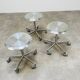 3 adjustable industrial stools with aluminum wheels