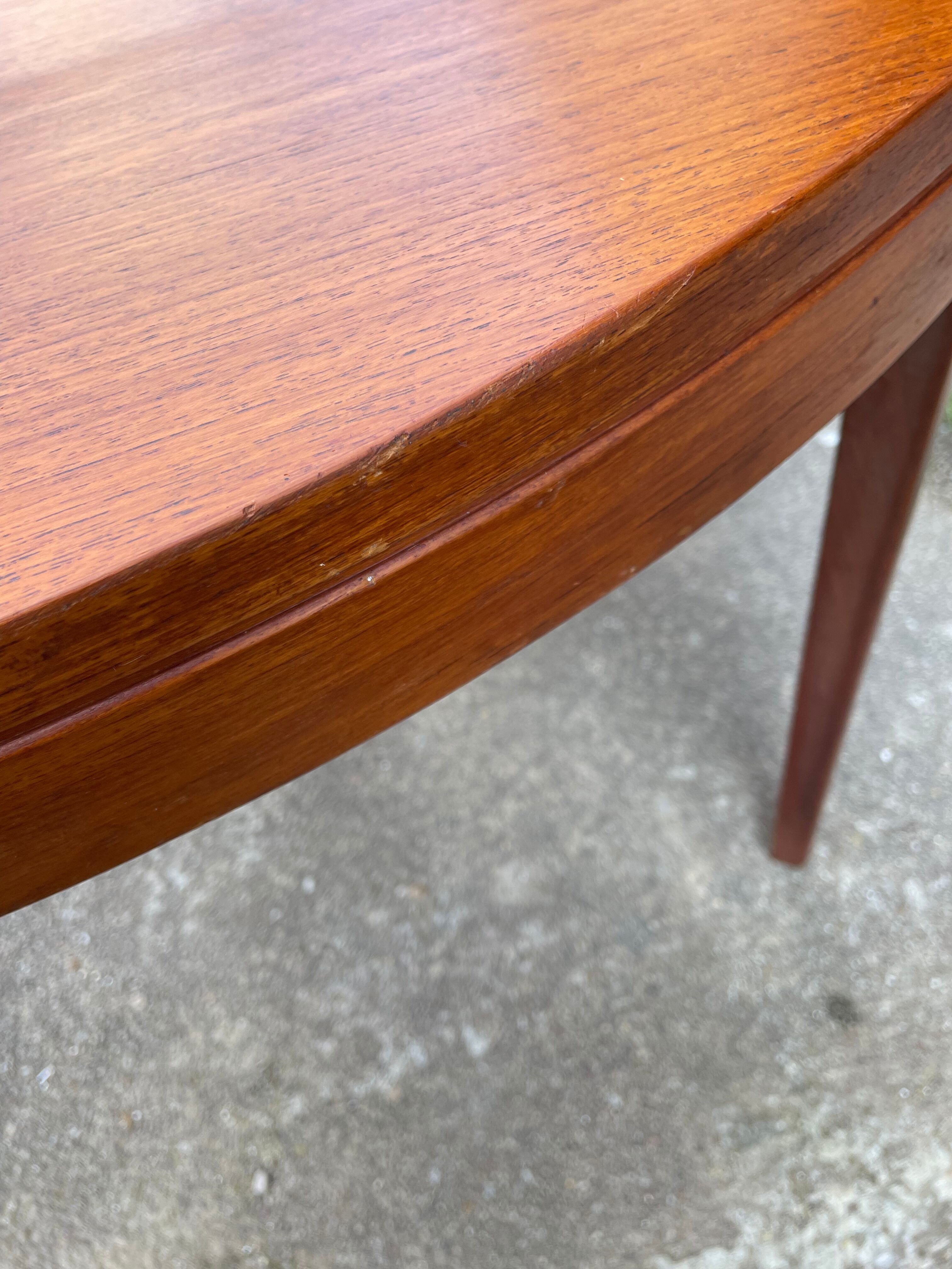 Round teak dining table
