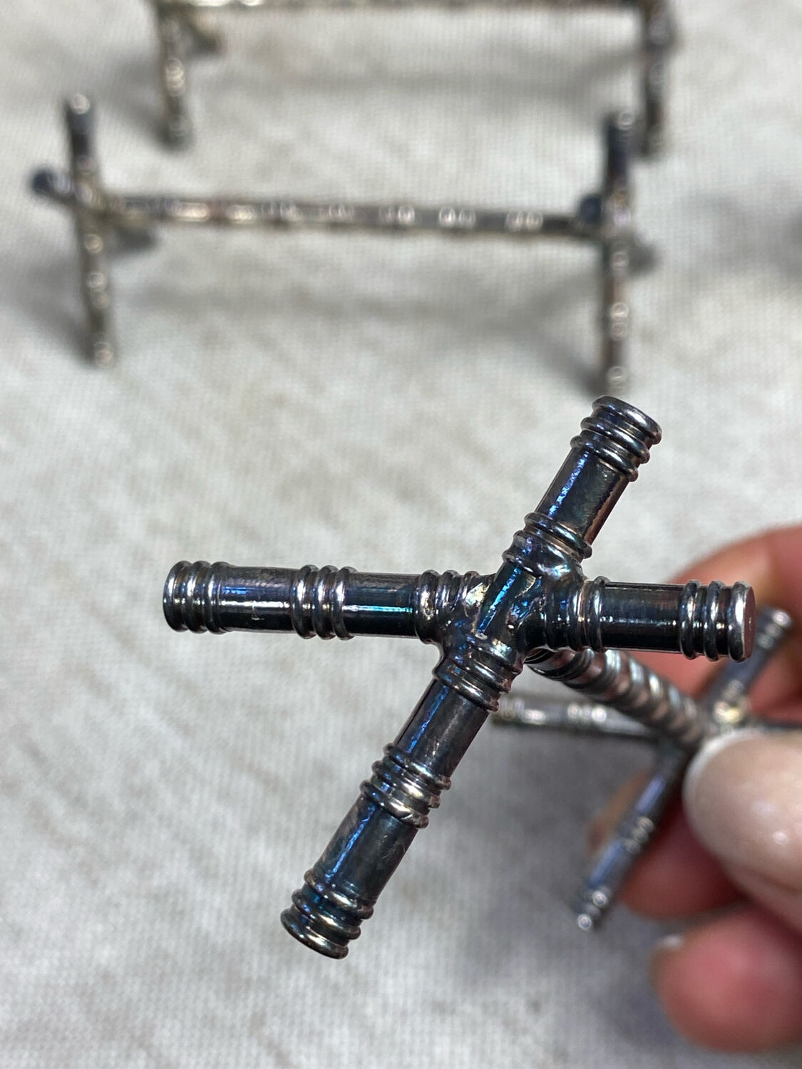 Six bamboo-patterned metal silver-plated knife rests.