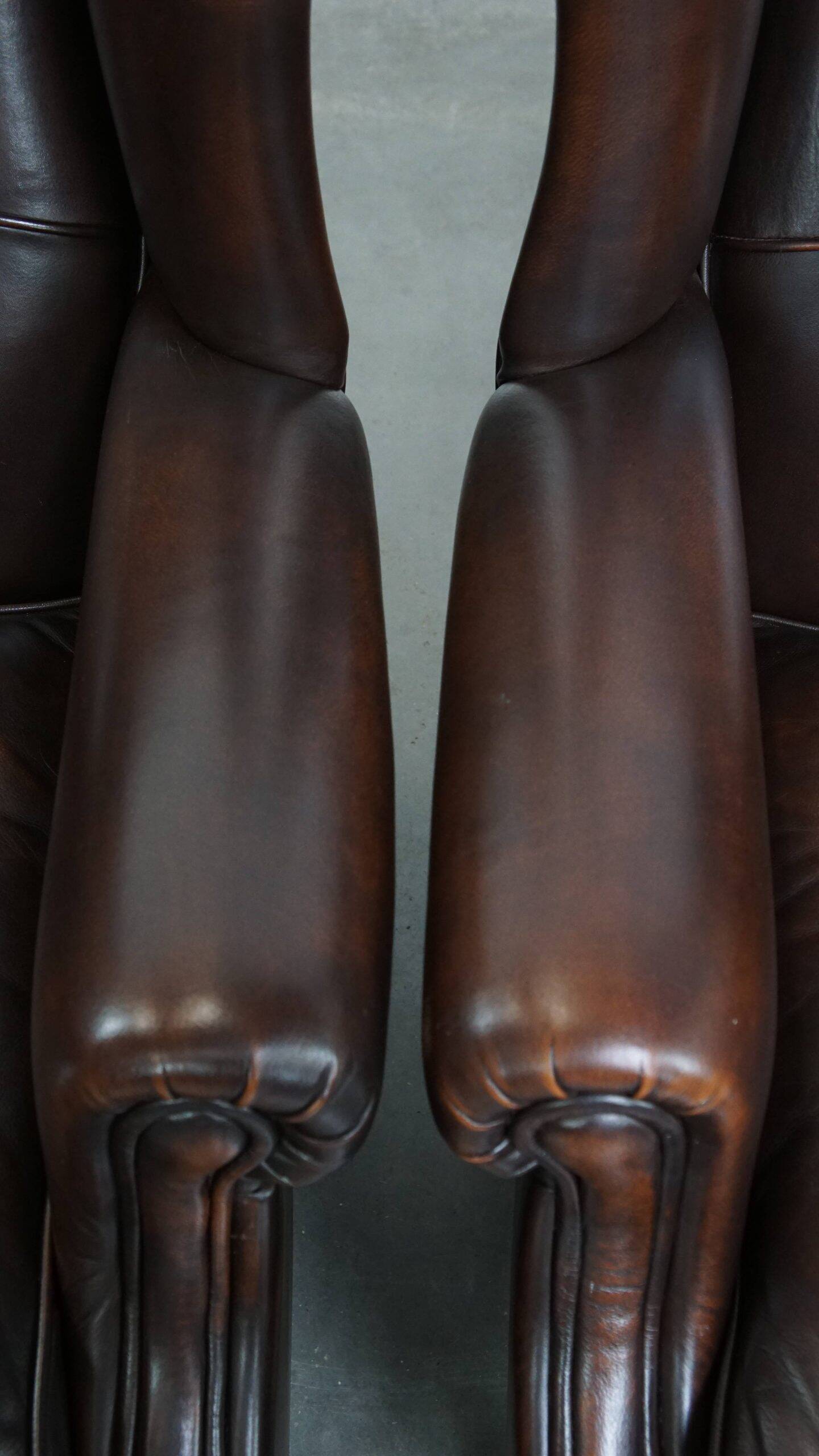 Comfortable and very beautiful set of 2 cow leather wingback armchairs in English style