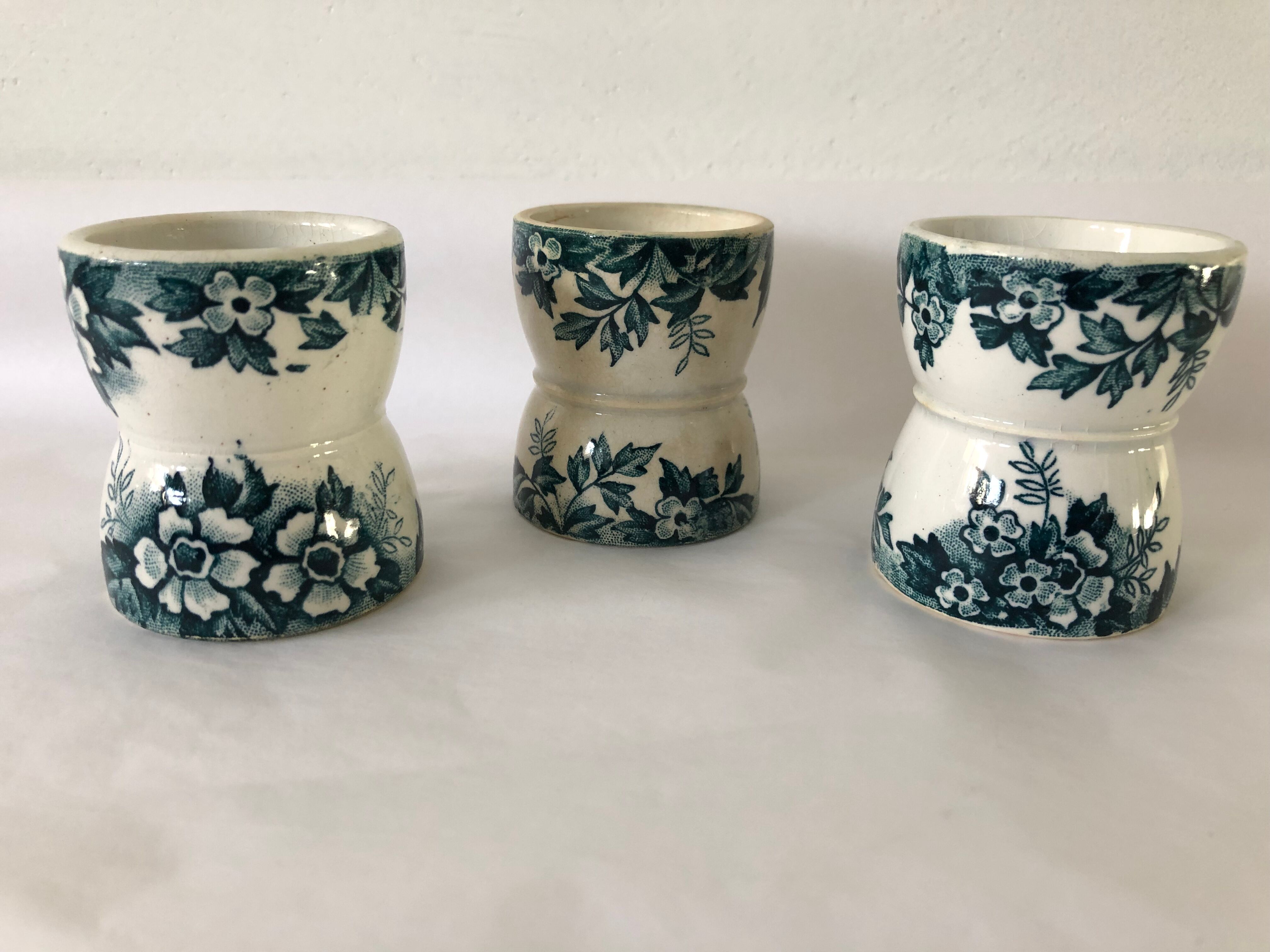 Trio of former egg cups earthenware