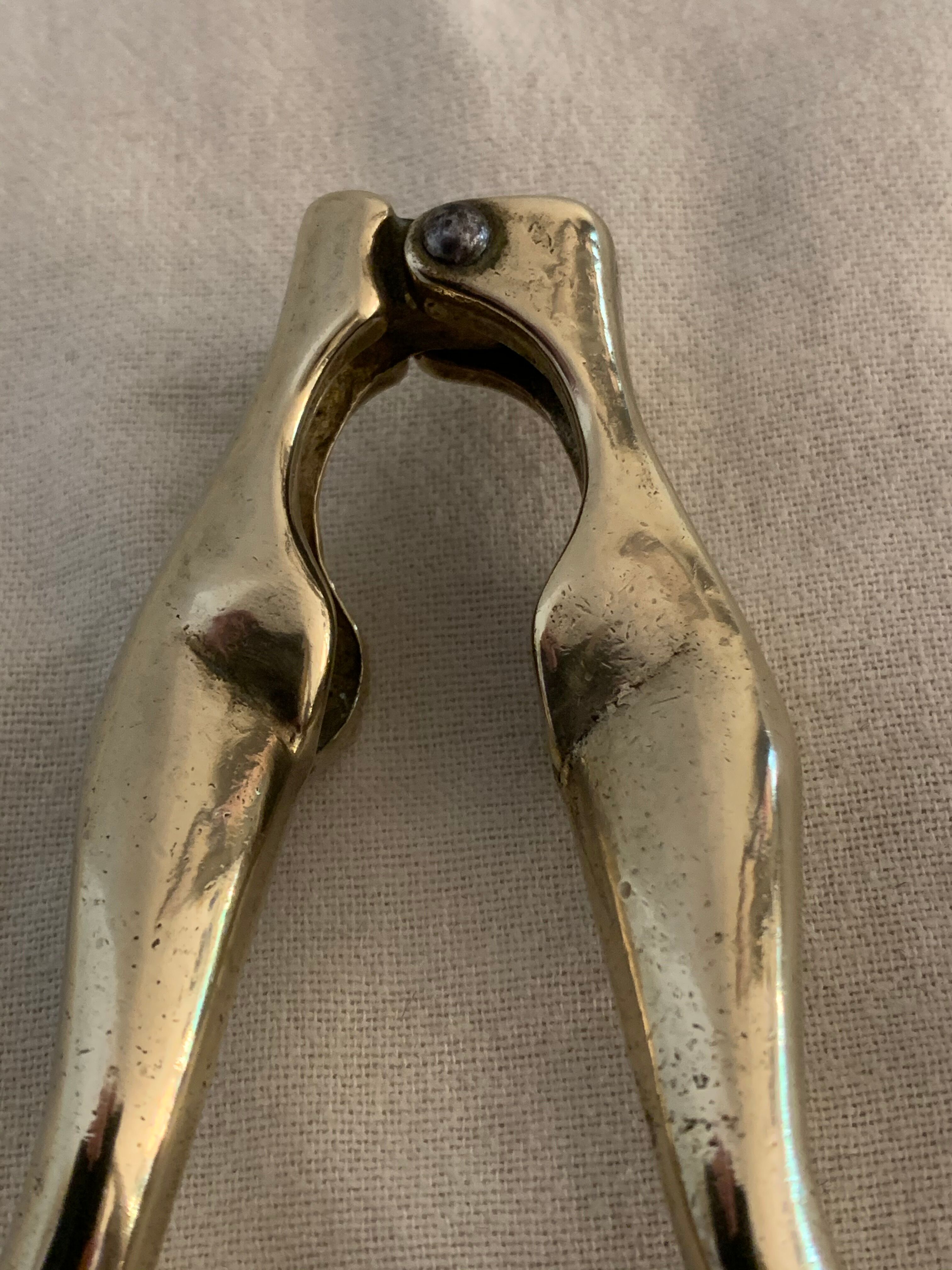 Pair of nutcrackers or anthropomorphic hazelnuts in bronze