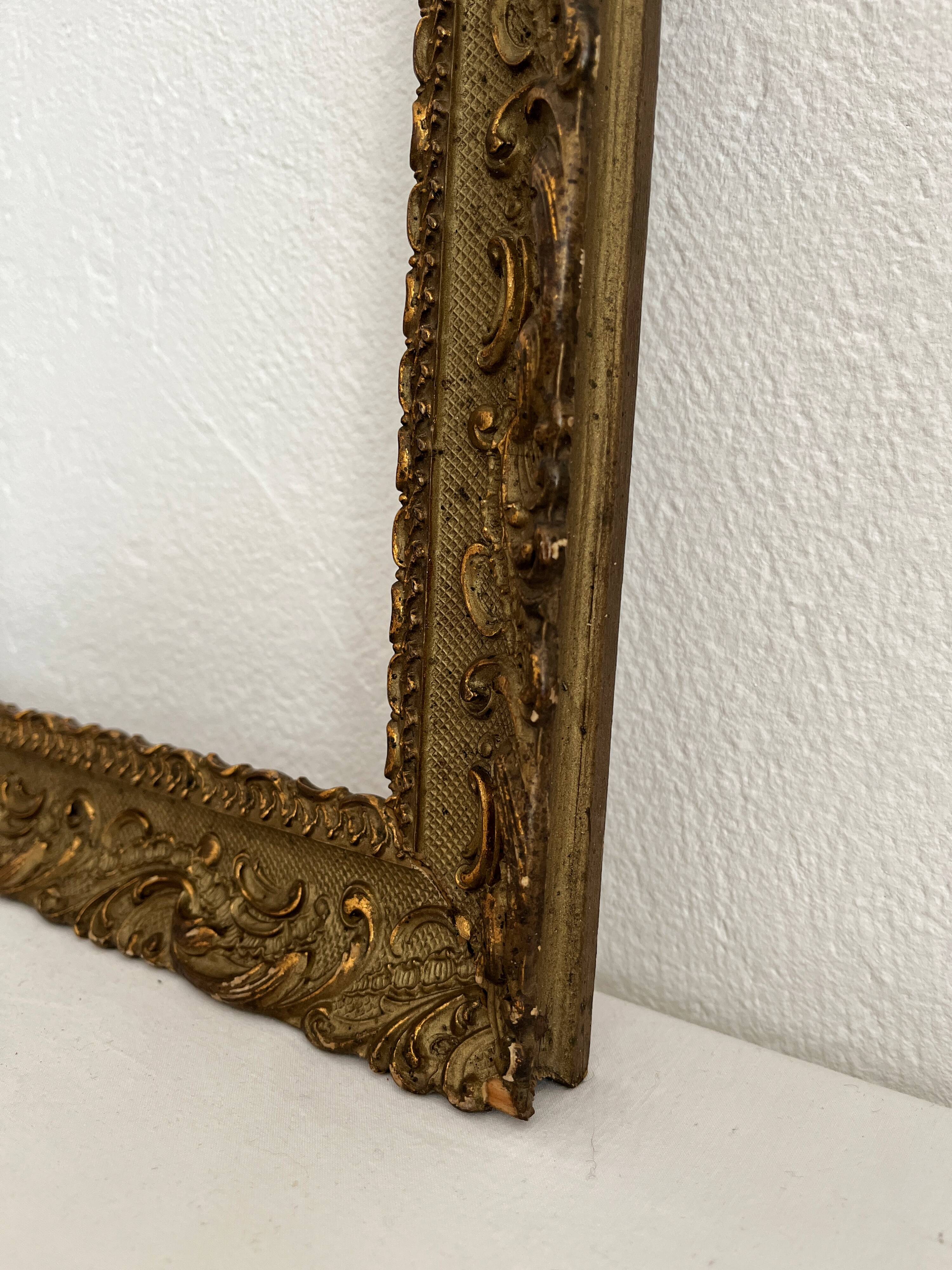 Old frame in gilded wood with stucco decoration circa 1900