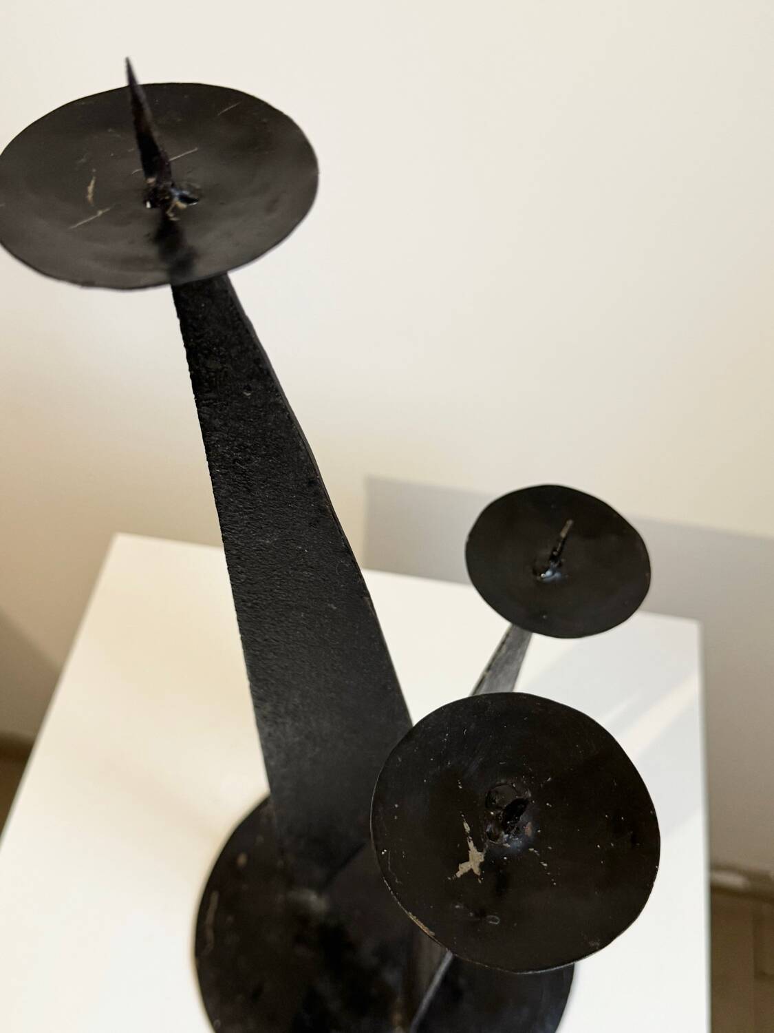 Vintage black metal brutalist tripod candlestick