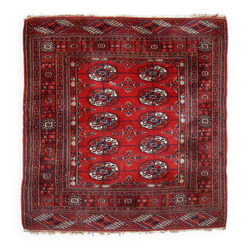 Tapis vintage fait main Tekke en laine rouge (109cm x 112cm) – Années 1970