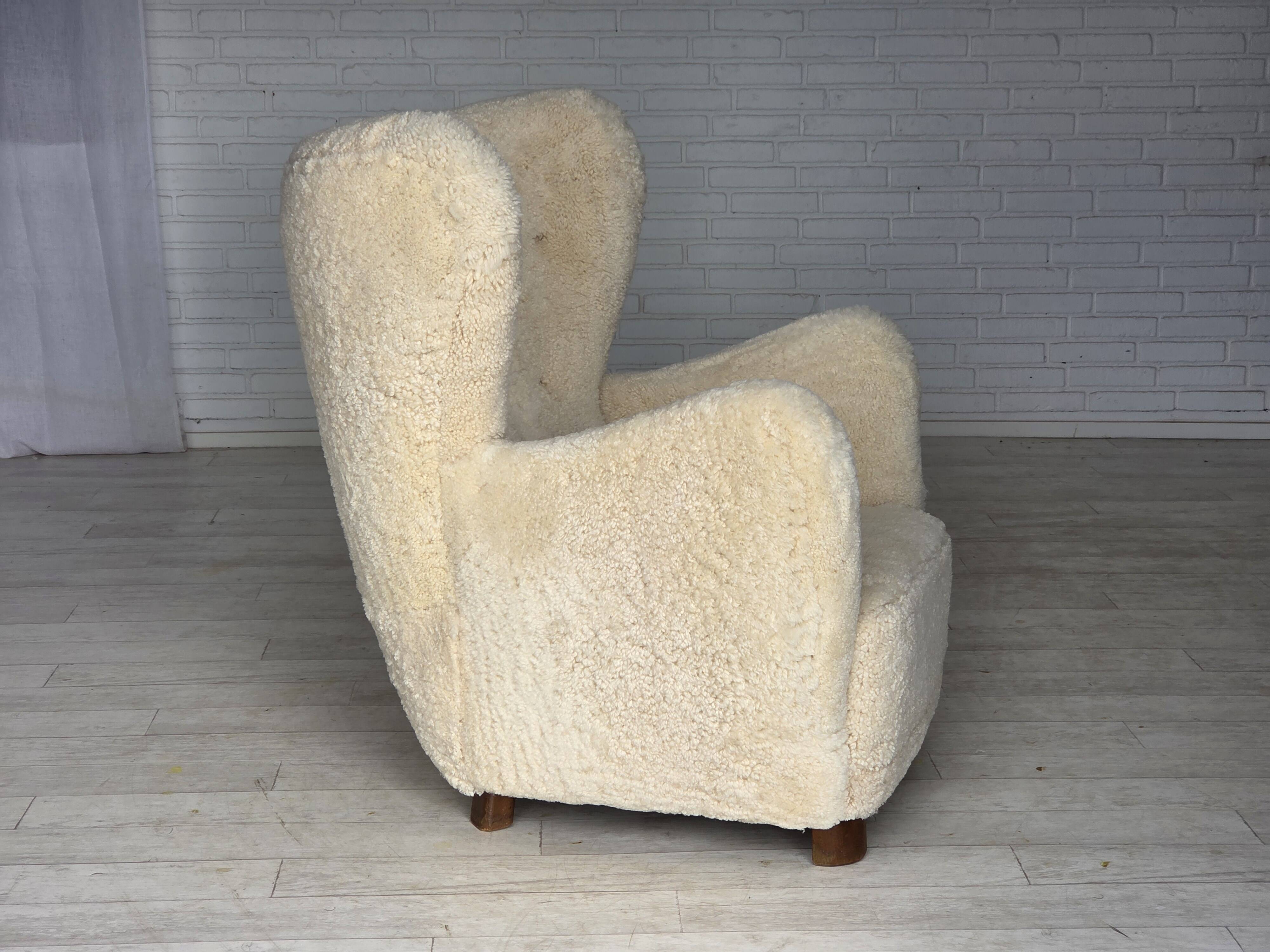 1960s, Danish armchair, genuine sheepskin "Canberra", reupholstered.